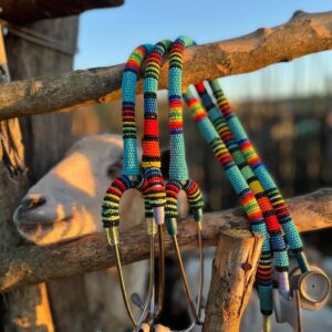 Beaded stethoscopes on rural farm backdrop - made with passion by Homba Crafts