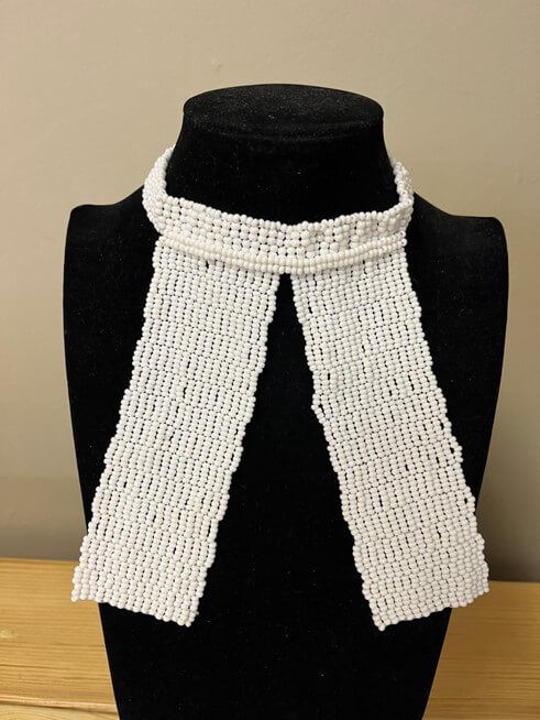 Beaded bib on display - made with passion by Homba Crafts