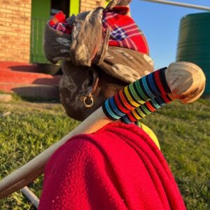 Induki - traditional Xhosa stick carried by Xhosa woman in rural backdrop - made with passion by Homba Crafts