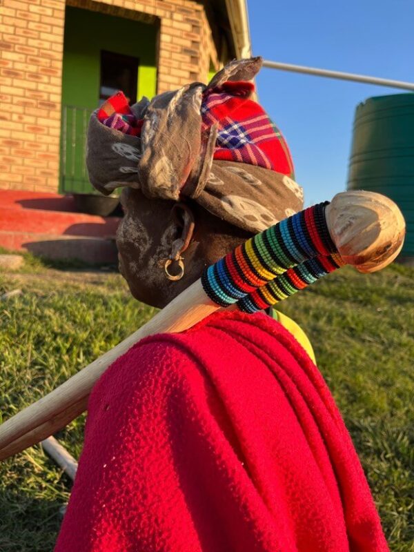 Induki - traditional Xhosa stick carried by Xhosa woman in rural backdrop - made with passion by Homba Crafts
